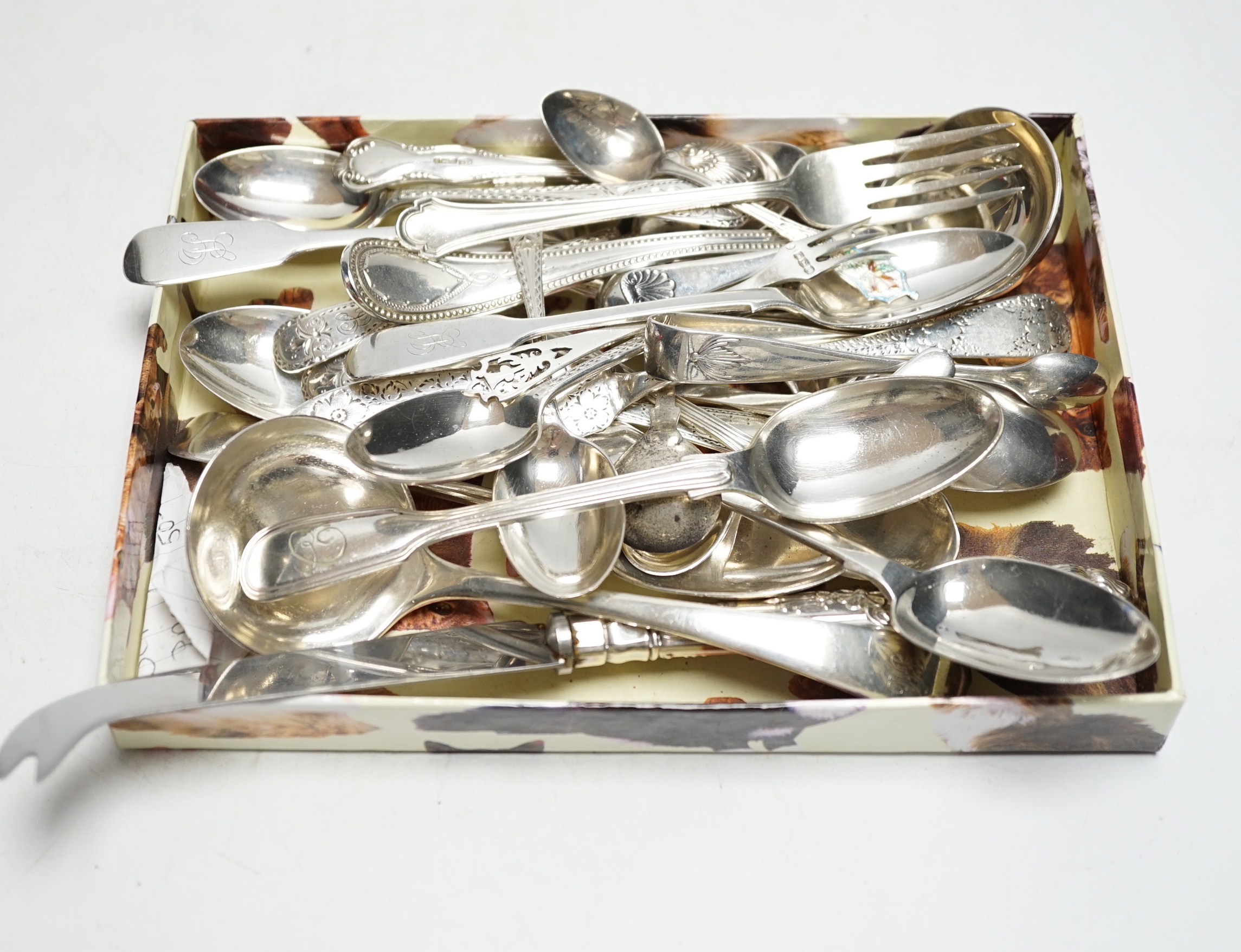 Sundry silver cutlery, including a butter knife, teaspoons, condiment spoons, sauce ladles, etc.